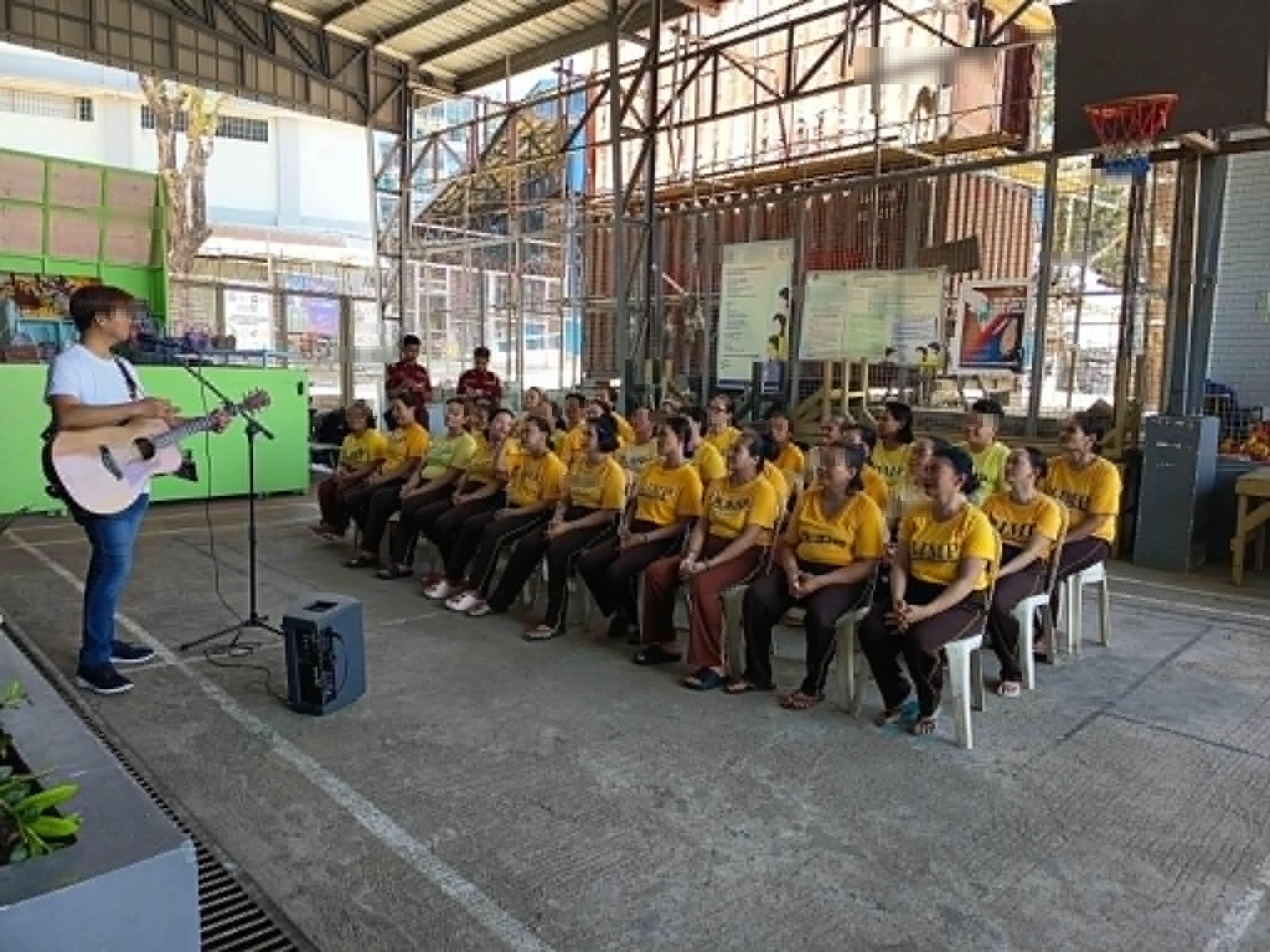 Handing out Bibles and bread to inmates