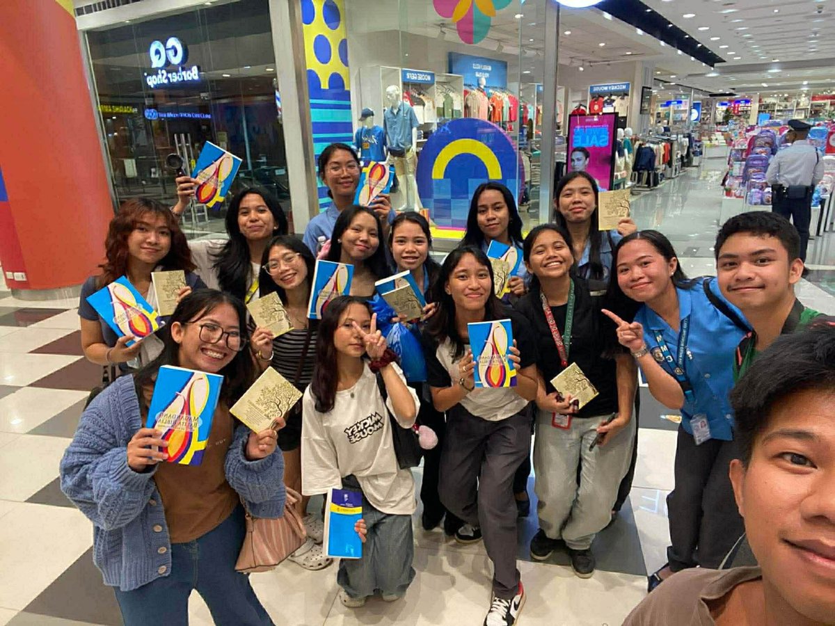Kate Torres distributing free Bibles during her mall busking sessions