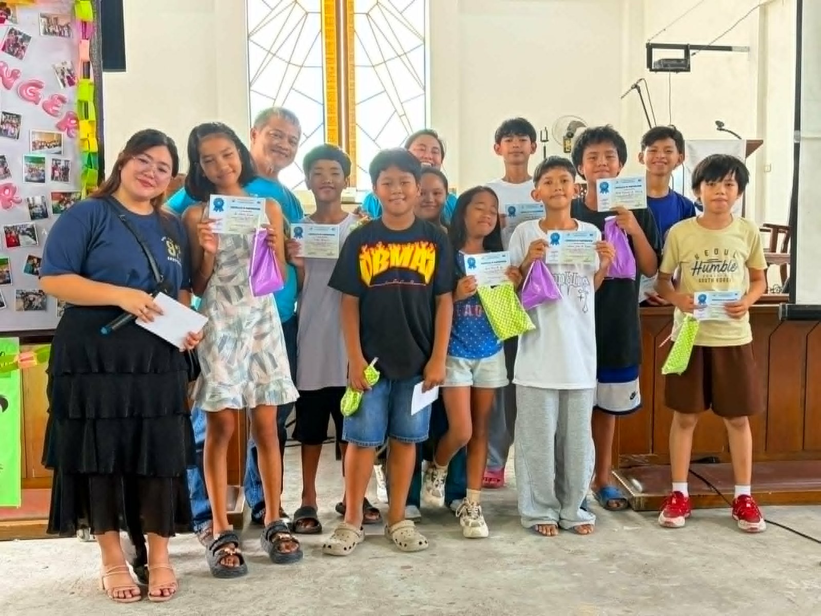 VCS M. Francisco Outreach in Pasay — children receiving Bibles